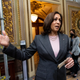 Vice President Kamala Harris stops to speak to reporters after casting the tie breaking vote to pass the Inflation Reduction Act in the Capitol on Sunday, August 7, 2022.